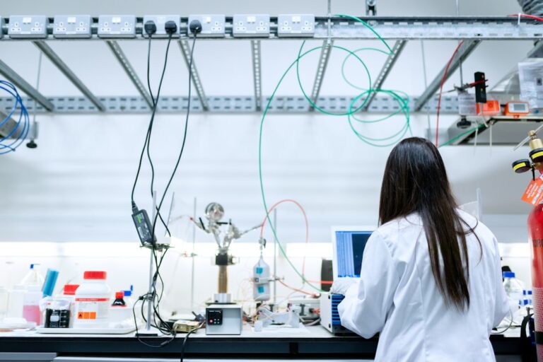 Research professional reviewing laboratory information and equipment